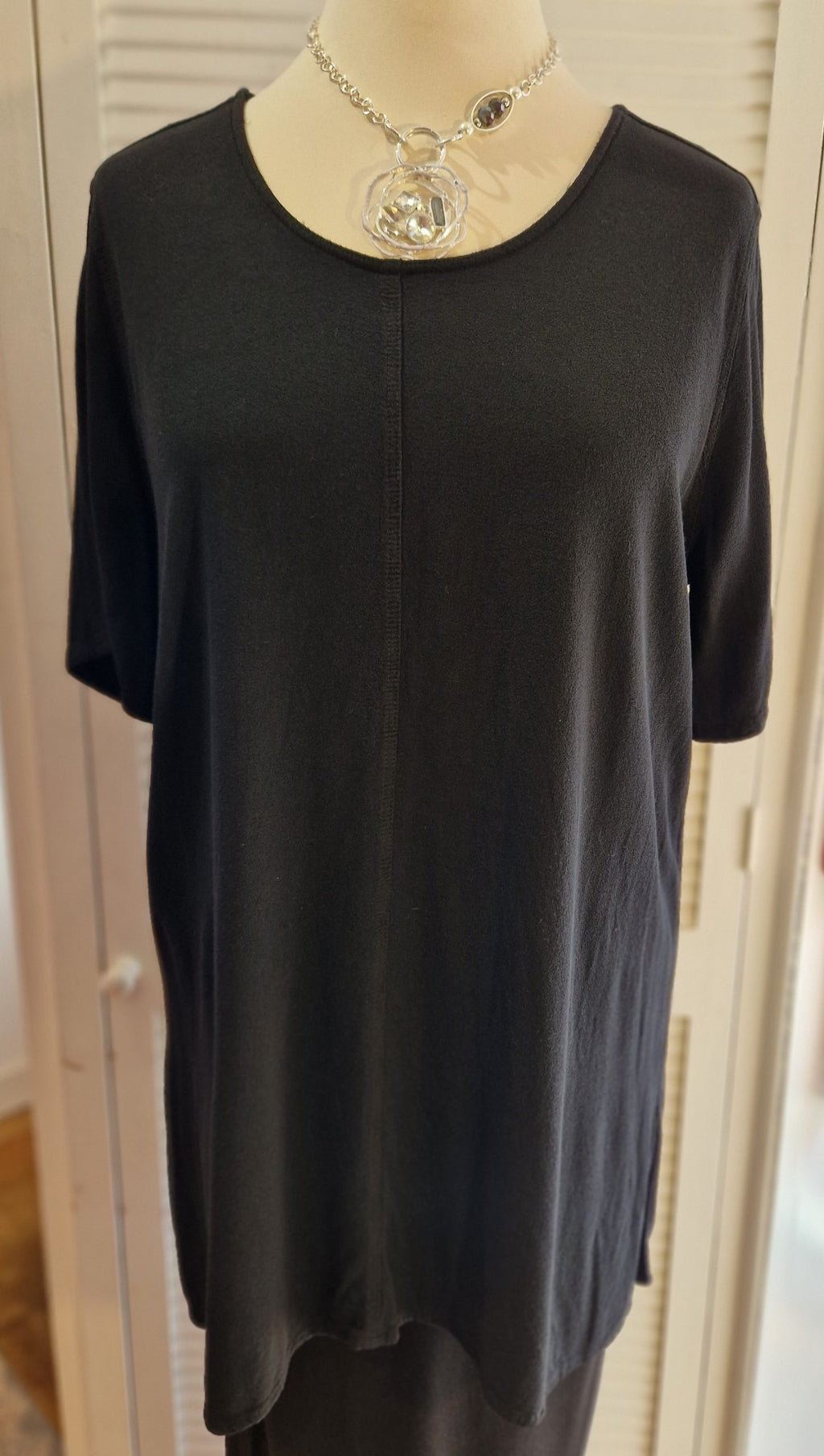 Our mannequin is modelling Belladonna crepe short sleeve top in black for Froxx Clothing