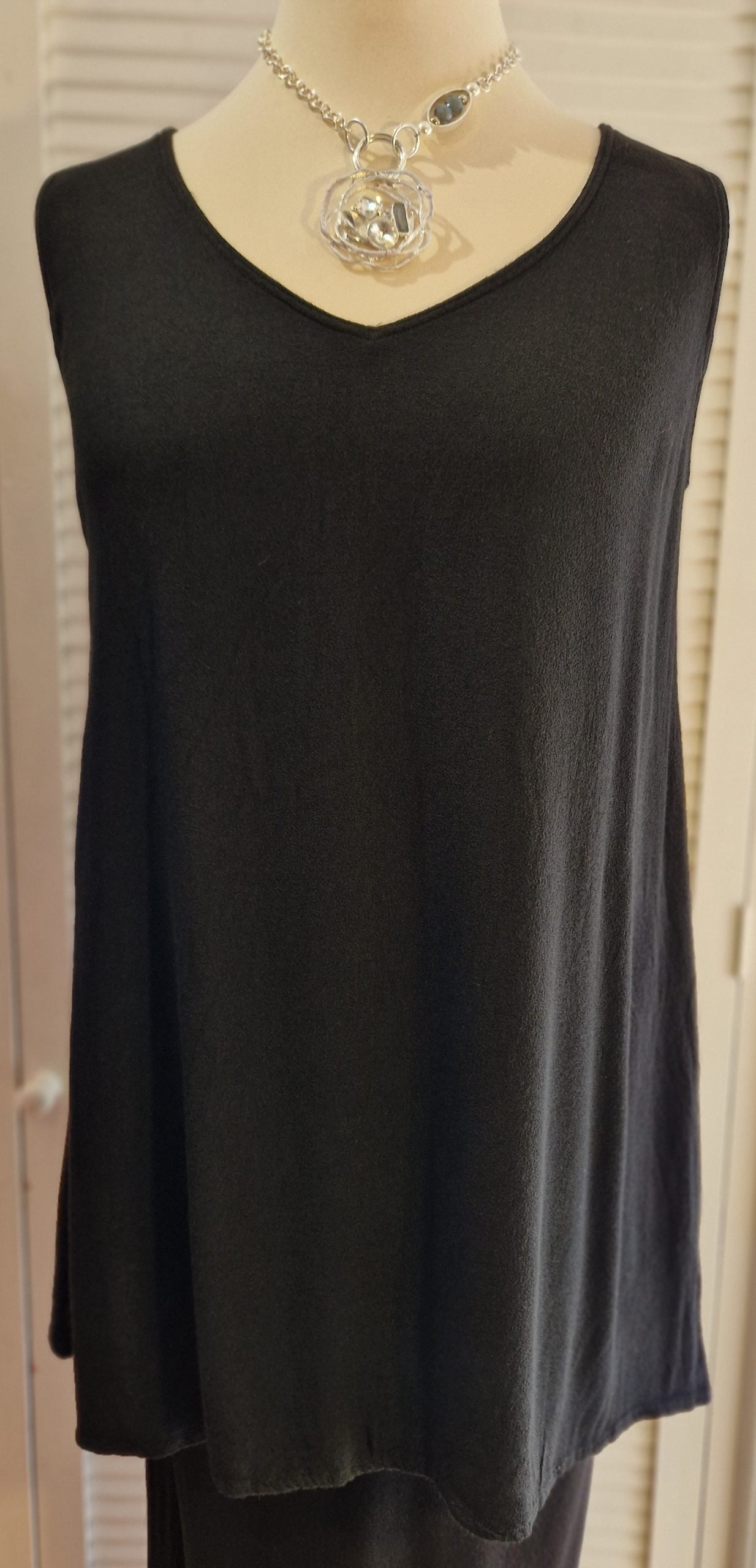 Our mannequin is modelling Belladonna crepe v neck vest in black for Froxx Clothing