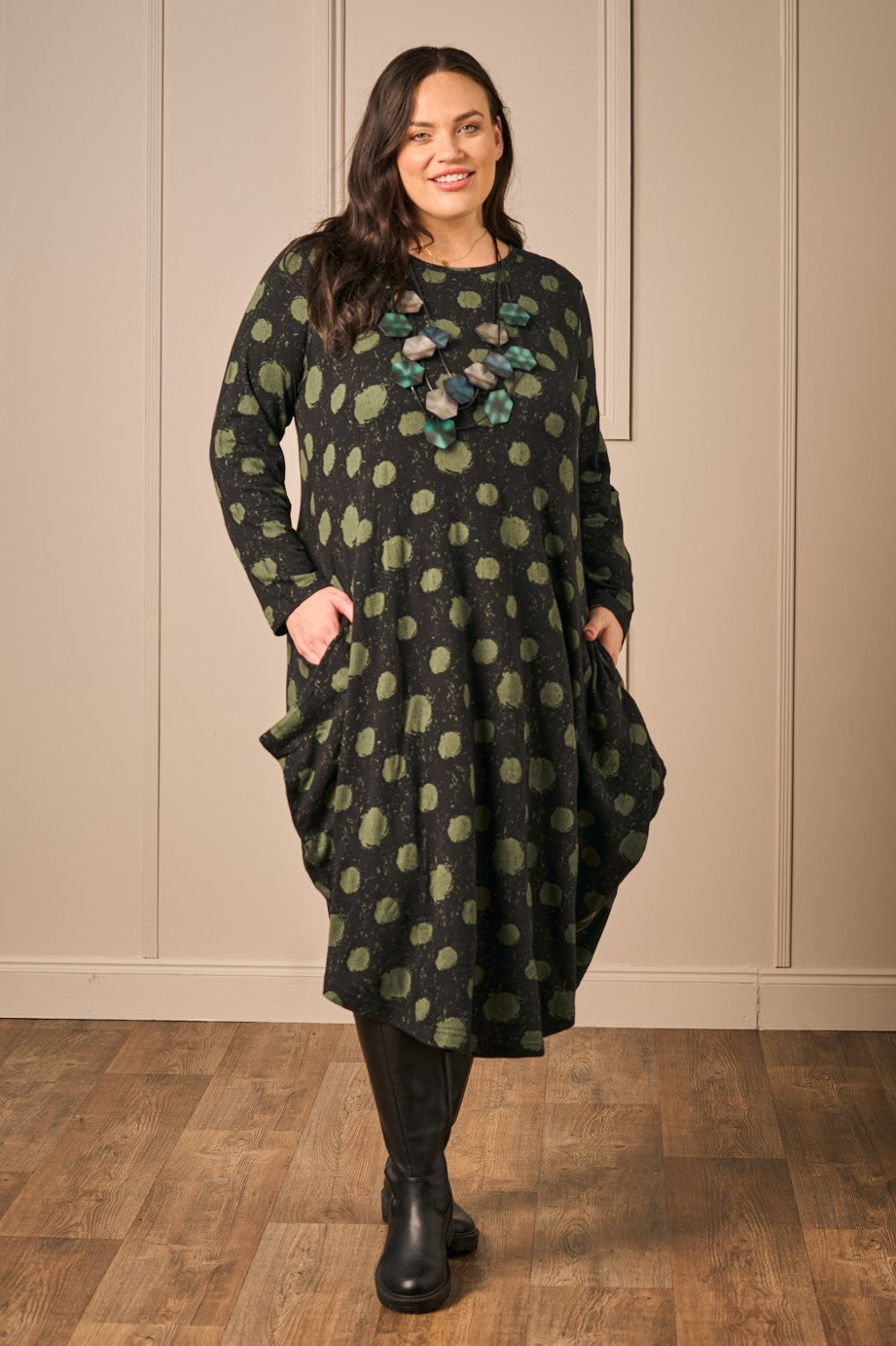 Our model is wearing Orientique jersey knit bubble dress in black for Froxx CLothing plus sizes