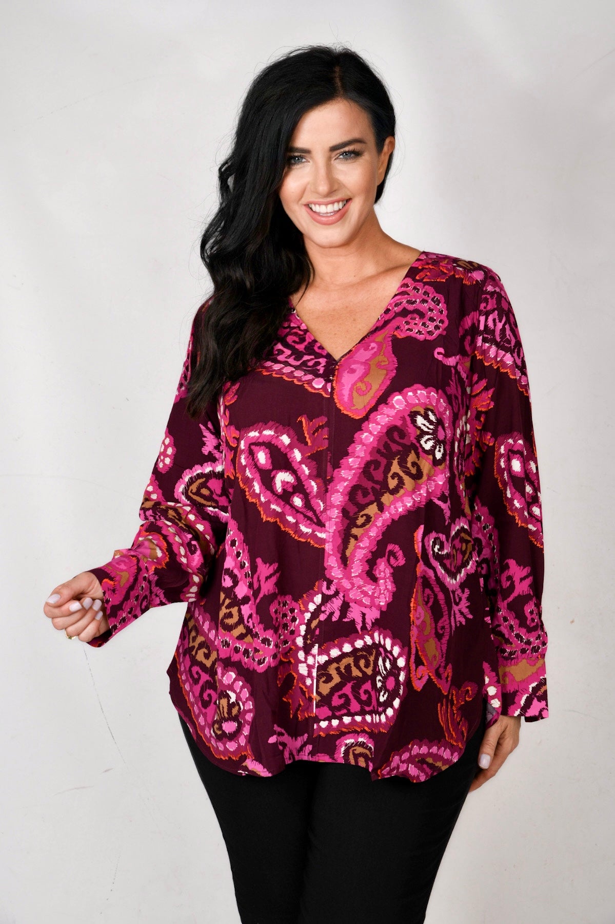 model is wearing Via Appia Paisley top in pinks for Froxx Clothing plus sizes