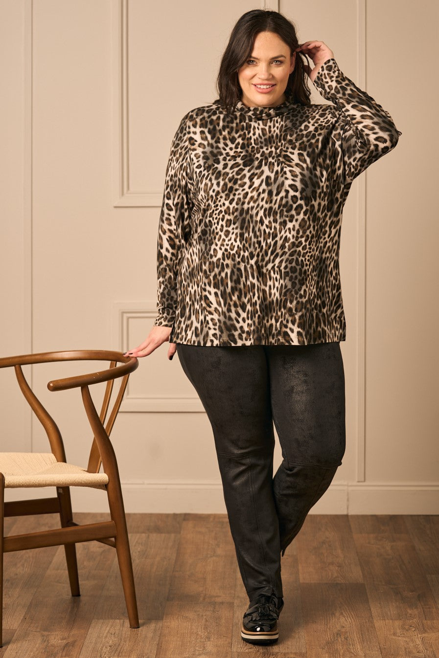 Our new model Zhana Paton is wearing Mona Lisa faux leather trousers in black for Froxx Clothing plus size shops