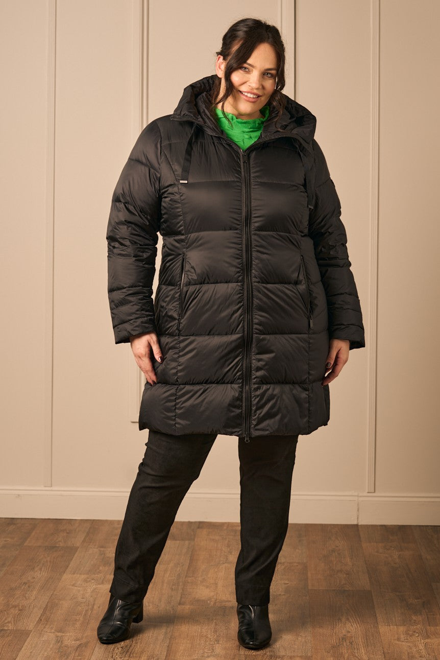 Our model is wearing Frandsen puffa jacket in black for Froxx Clothing plus sizes in Kings Langley