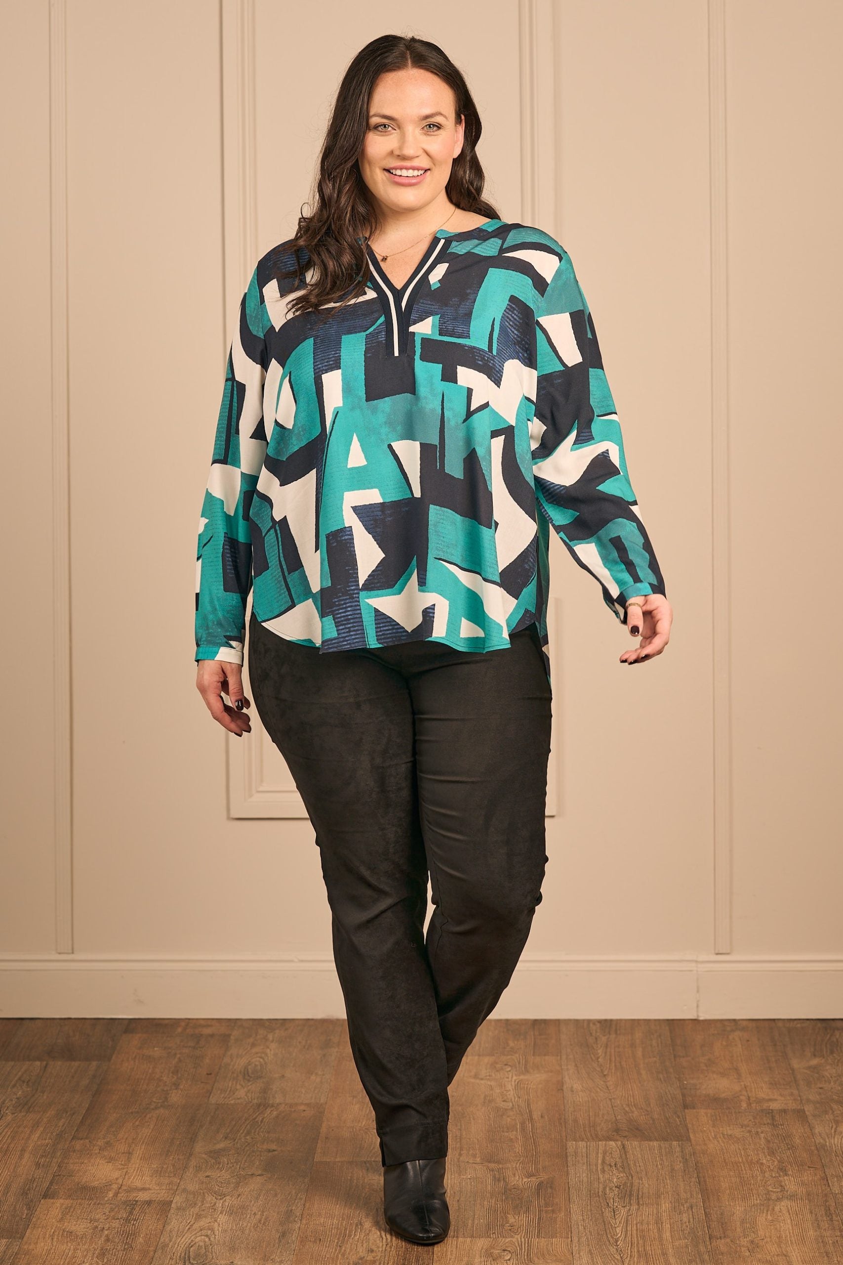 Our model is wearing Via Appia kaftan neck tunic in emerald for Froxx Clothing plus sizes