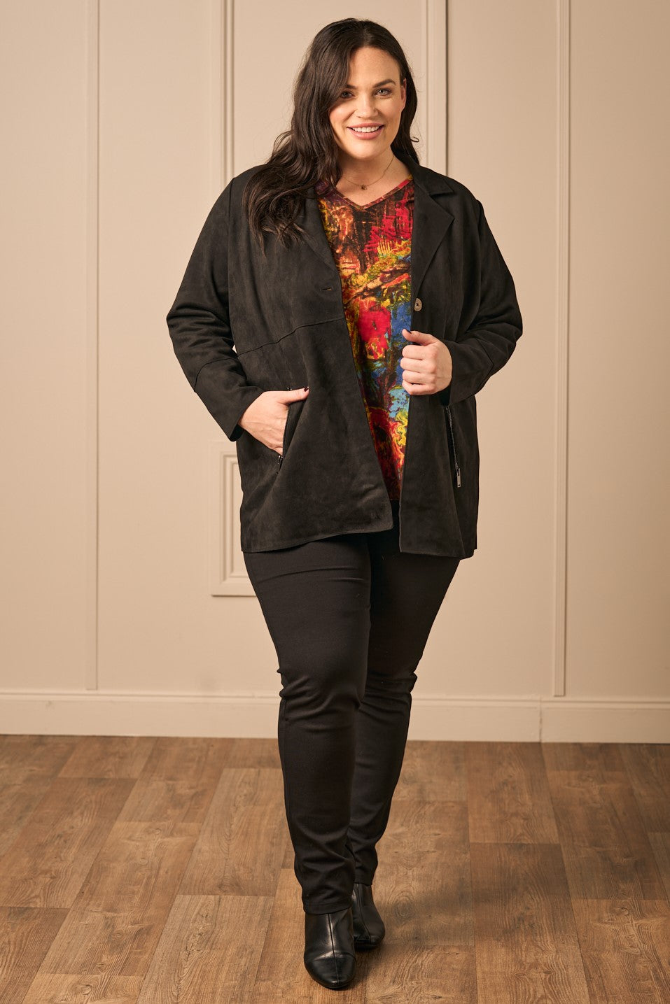 Our model is wearing Via Appia faux suede jacket in black for Froxx Clothing plus sizes