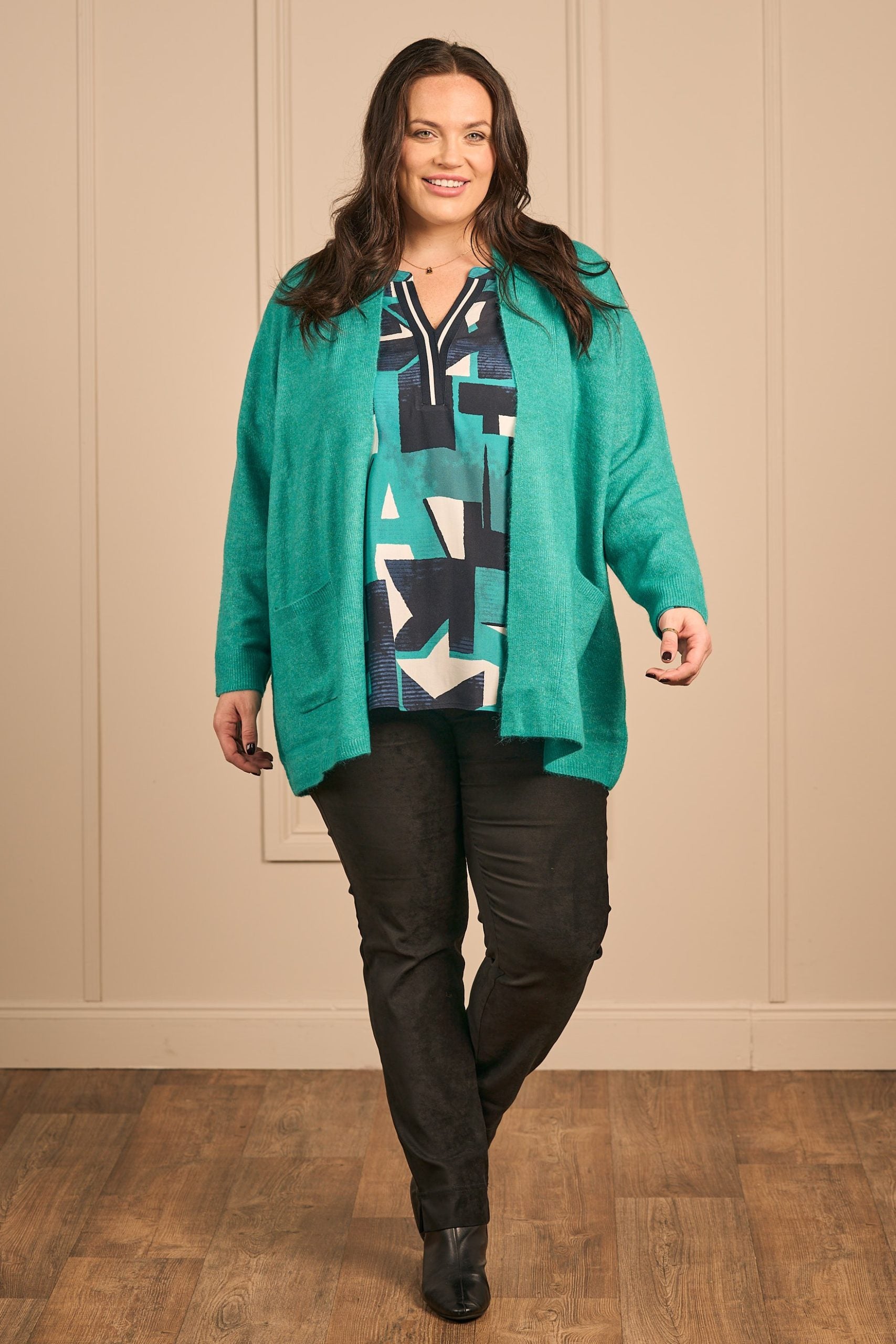Our model is wearing Via Appia edge to edge cardi in emerald for Froxx Clothing plus size specialists