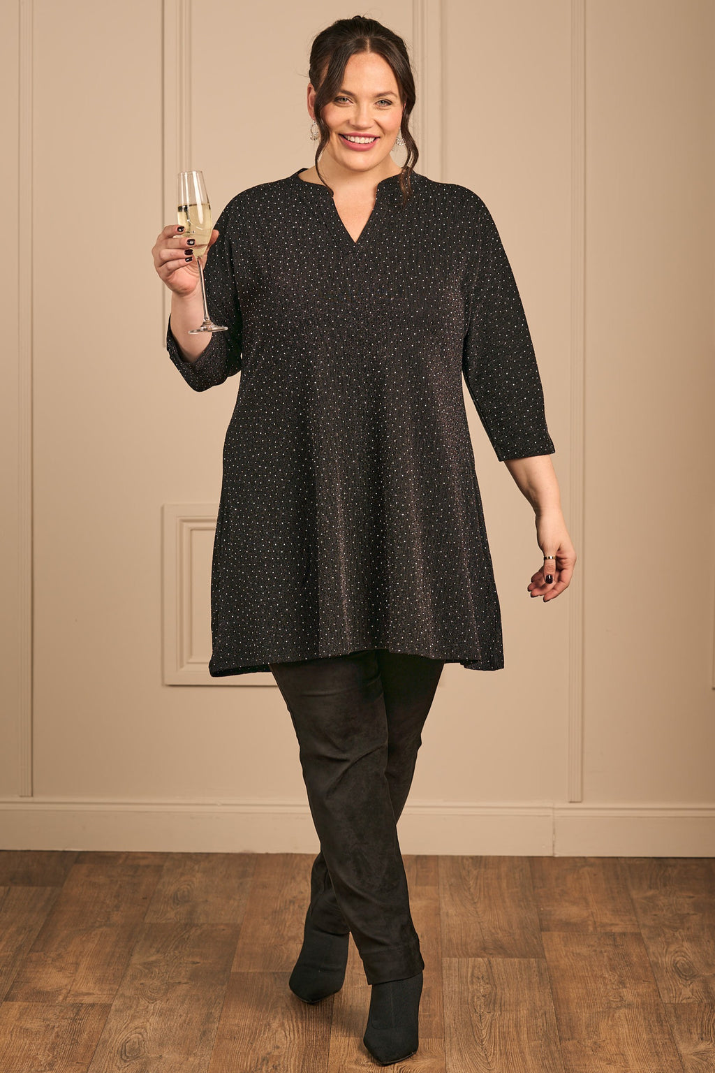 OUr model is wearing Ciso sparkly tunic in black for Froxx Clothing