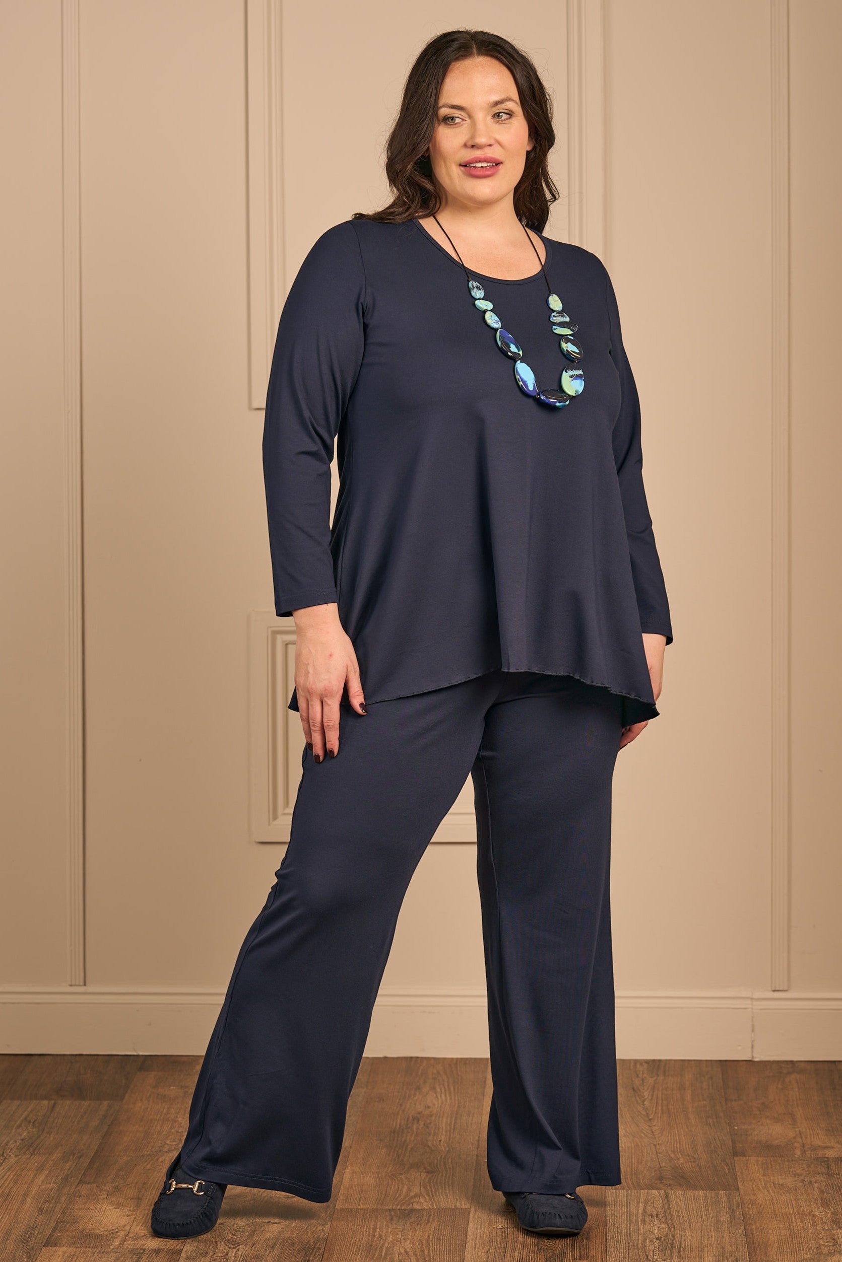 Our model is wearing Exelle Balo jersey palazzos in navy for Froxx Clothing