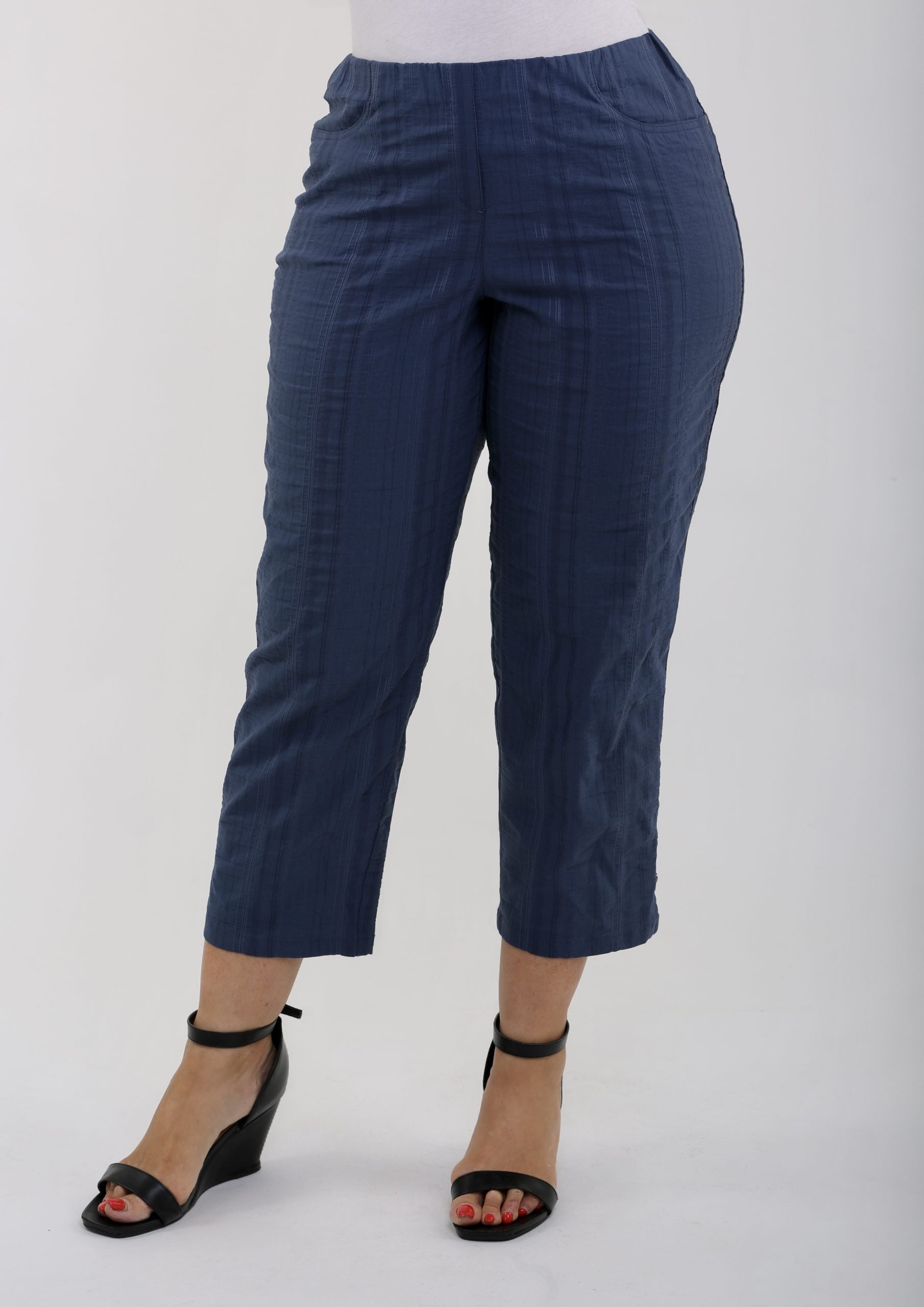 Woman wearing denim summer crops by KJ Brand