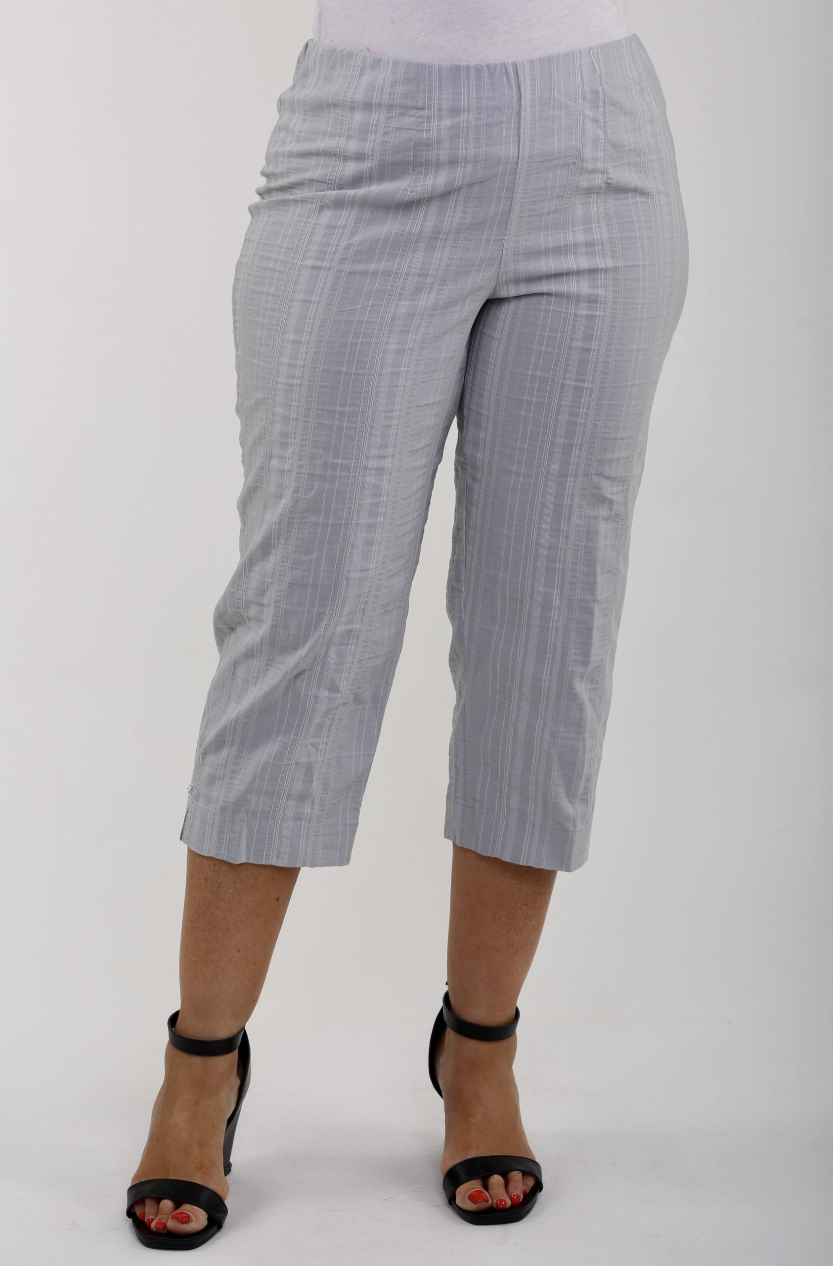 Woman wearing KJ Brand Wash & Go stretch pedal pushers in silver grey