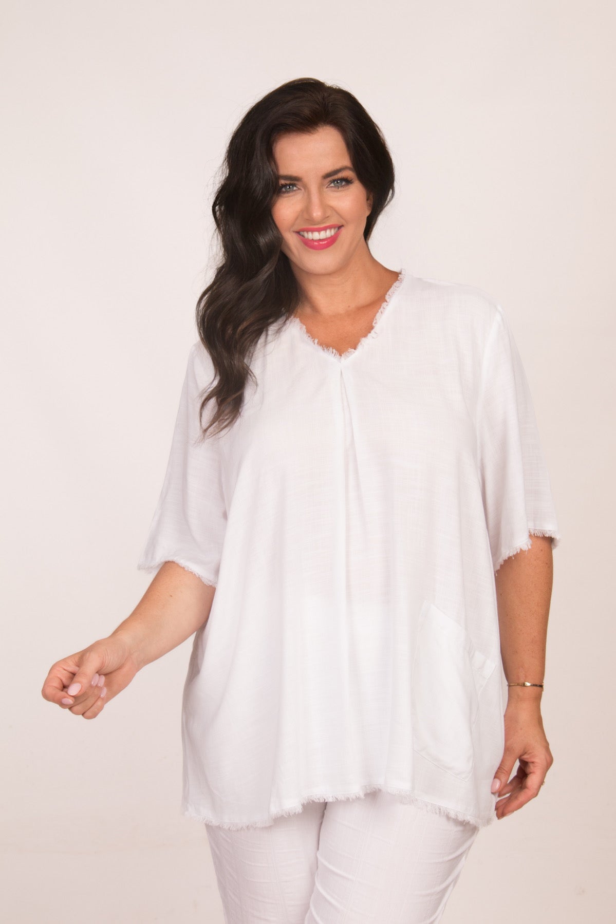 Our model is wearing See You frayed top in white for Froxx Clothing