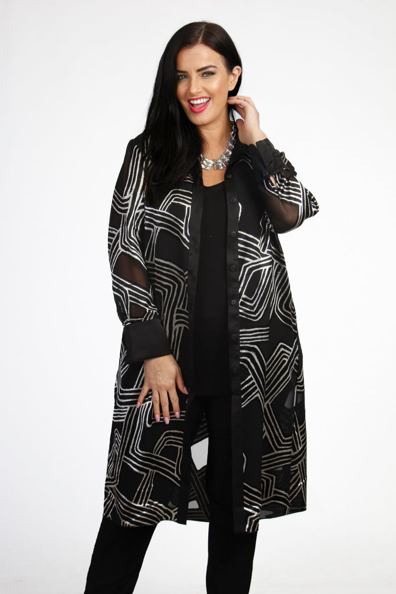 Our model is wearing Mona Lisa abstract long jacket in black and silver for Froxx Clothing