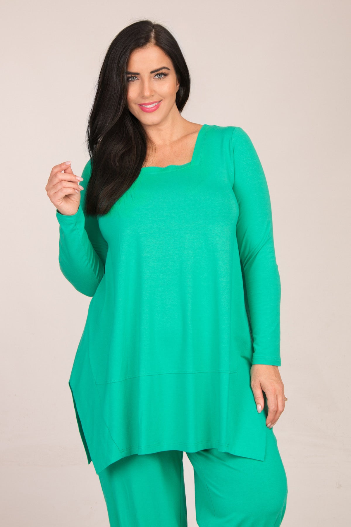 Our model is wearing Noen jersey panel tunic in mint for Froxx CLothing plus sizes