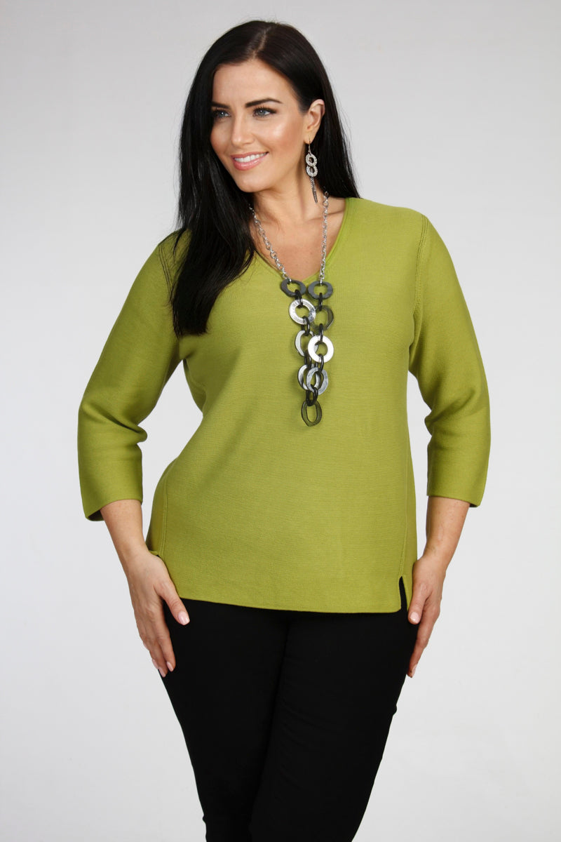 Our model is wearing Via Appia cotton v neck jumper in lime for Froxx Clothing