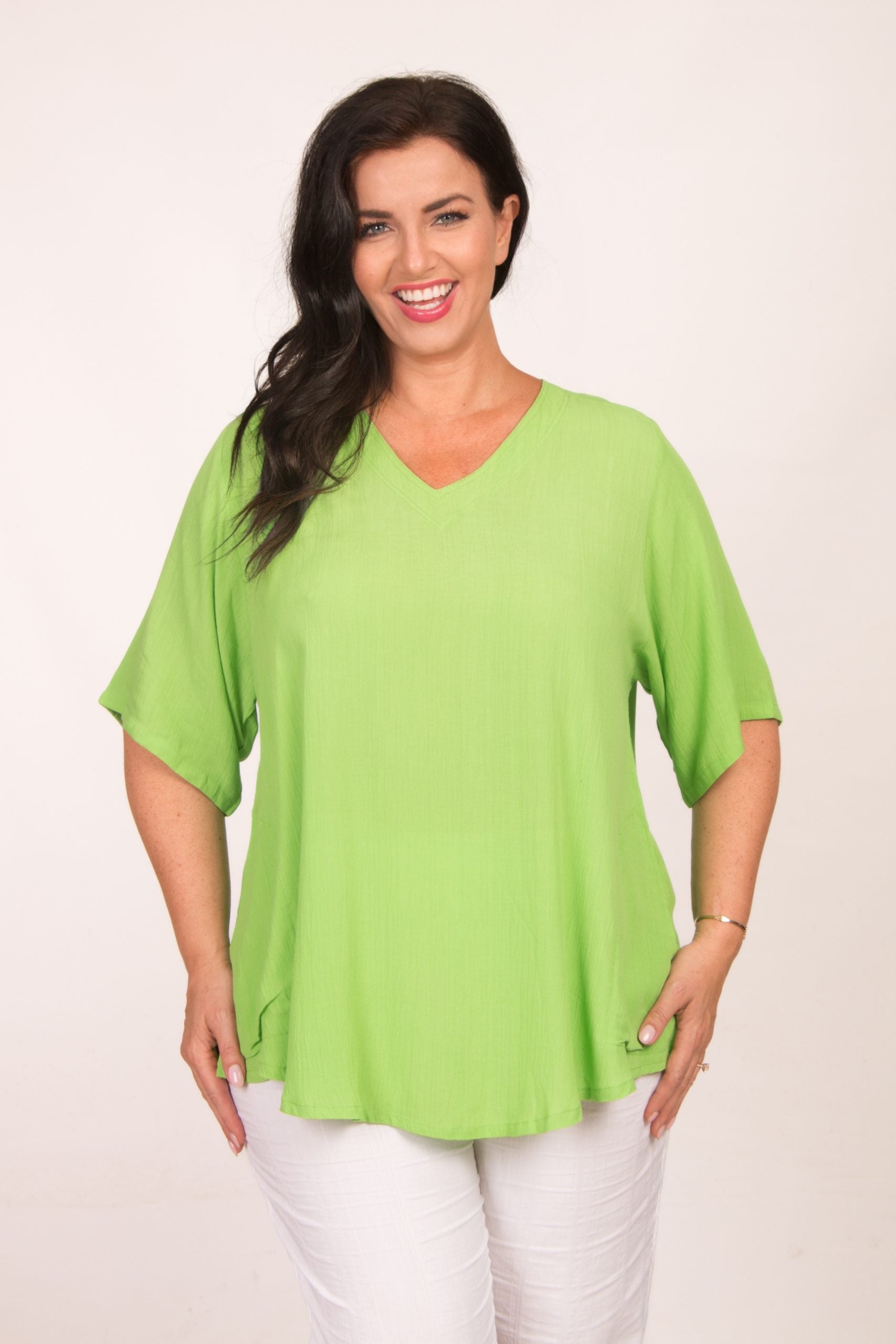 OUr model is wearing Angel CIrcle swing top in Apple for Froxx Clothing plus sizes