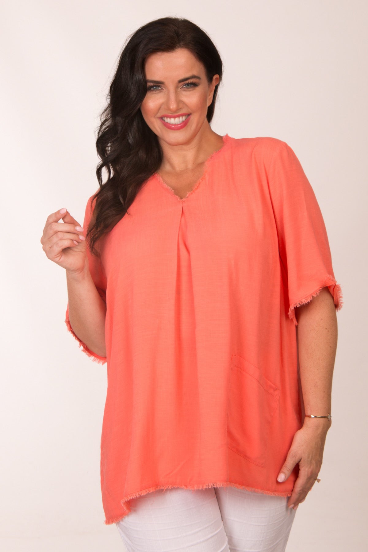 Our model is wearing See You frayed top in coral for Froxx Clothing