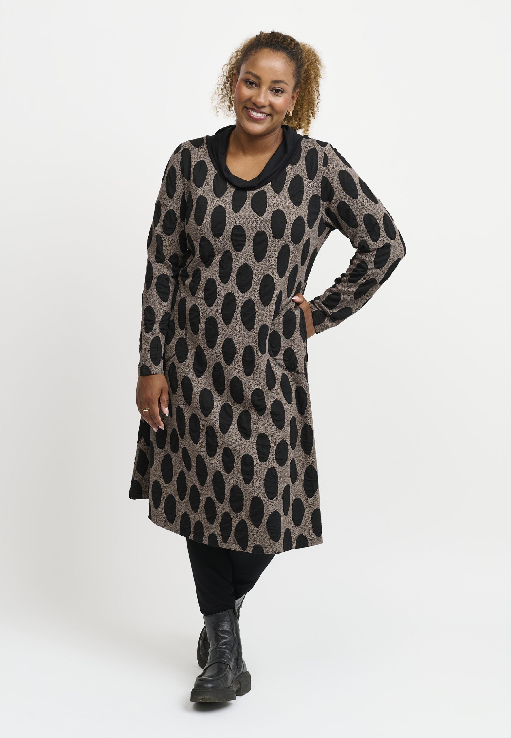 Our model is wearing Pont Neuf Vally jersey cowl dress in taupe for Froxx Clothing plus sizes