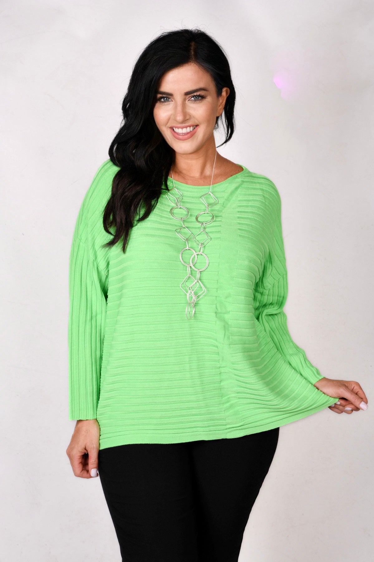 Woman is wearing Doris Streich rib jumper in acid green for Froxx Clothing plus sizes