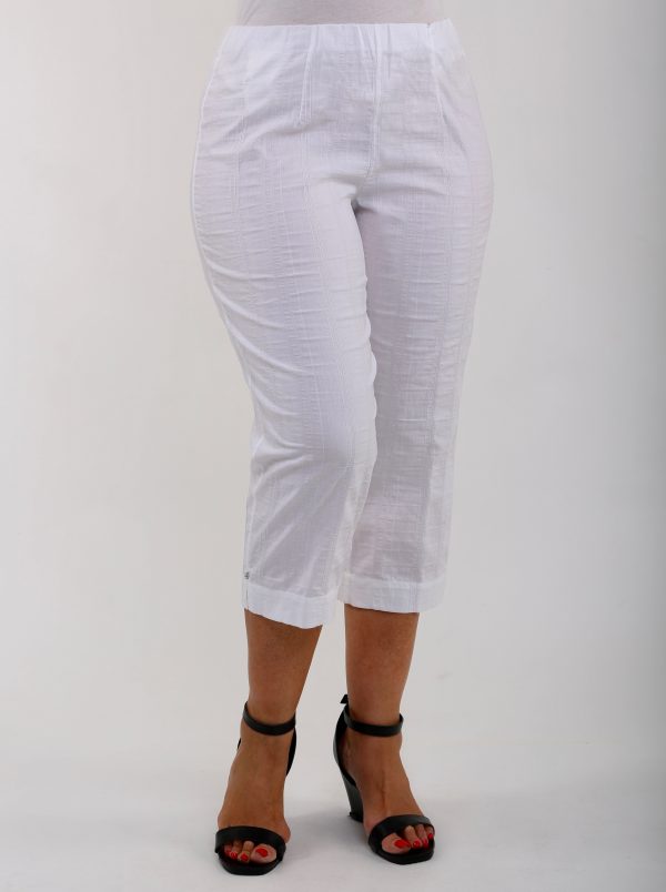 Woman wearing white KJ Brand Wash & Go pedal pushers
