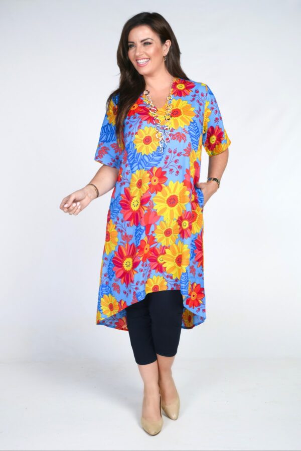 Model is wearing Angel Circle flower power dress in cobalt for plus sizes