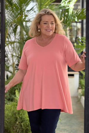 Our model is wearing Kasbah Tessa jersey short sleeve tee in coral for Froxx Clothing plus sizes