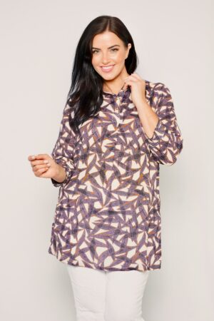 Our model is wearing Ciso leaf print tunic in purple for Froxx Clothing plus sizes