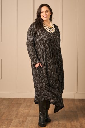 Our model is wearing AKH Vanilla jacquard jersey dress in black for Froxx Clothing plus sizes
