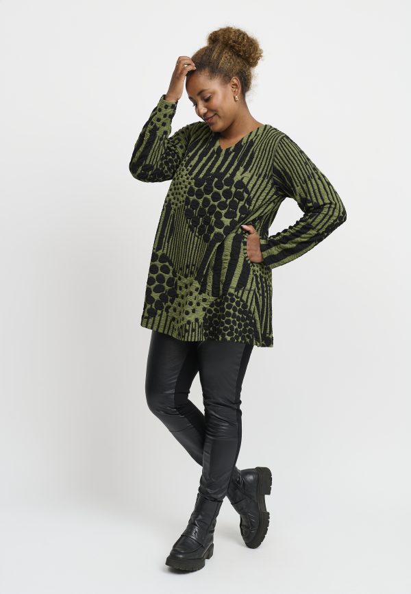 Our model is wearing Pont Neuf Melina jersey tunic in forest green for Froxx Clothing plus sizes