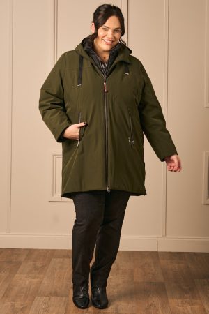Our model is wearing Frandsen water repellant 3 in 1 jacket in bottle green for Froxx Clothing plus sizes boutique in Kings Langley