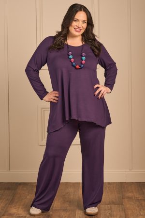 OUr model is wearing Exelle Buto jersey trousers in purple for Froxx Clothing plus sizes