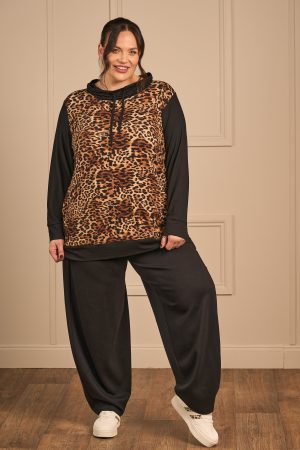 Our model is wearing KJ Brand jersey harem trousers in black for Froxx Clothing plus sizes
