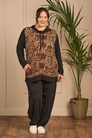 Our model is wearing KJ Brand jersey leopard block top in black and animal print for Froxx Clothing plus sizes